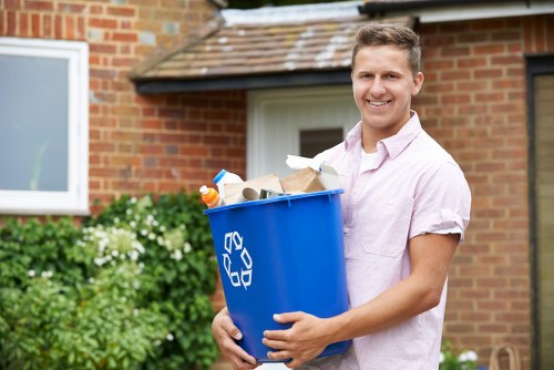 Professional clearers sorting items for donation and recycling